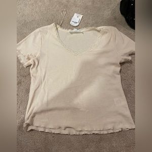 cream colored t-shirt